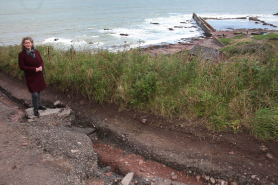 Angus councillor Lois Speed at the badly-eroded Auchmithie road.