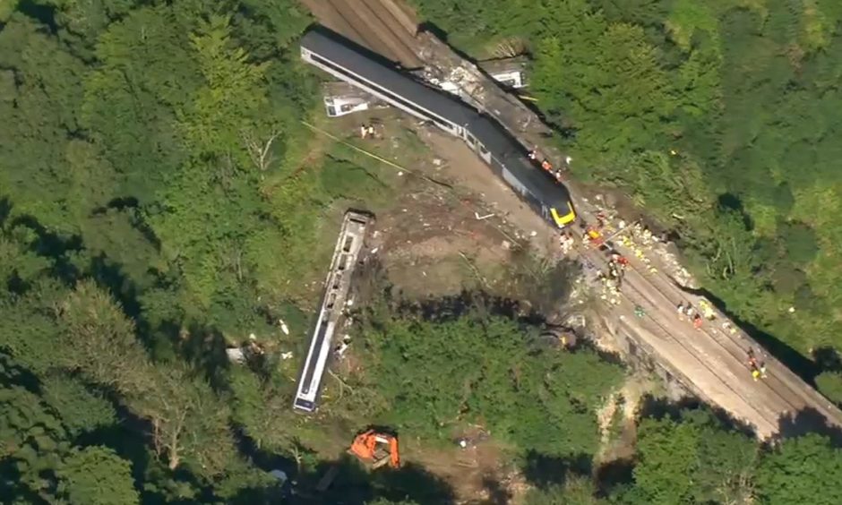 Aerial images showing the derailed train near Stonehaven.