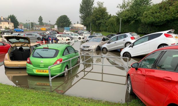 Staff cars written off at flood hit hospital car park at Victoria Hospital in August.