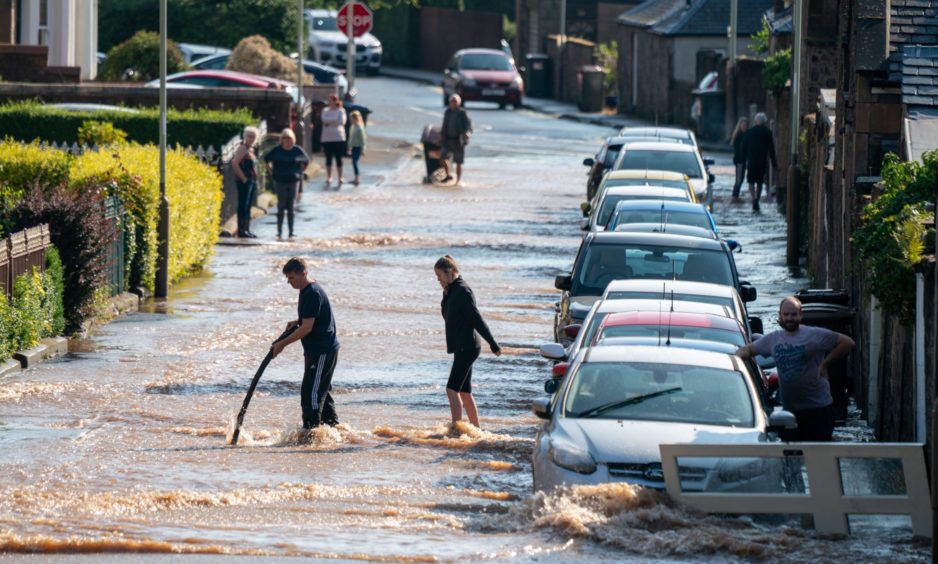 Flooding on Queen Street, Perth, following severe weather in August 2020. Image: Kenny Smith/DC Thomson.