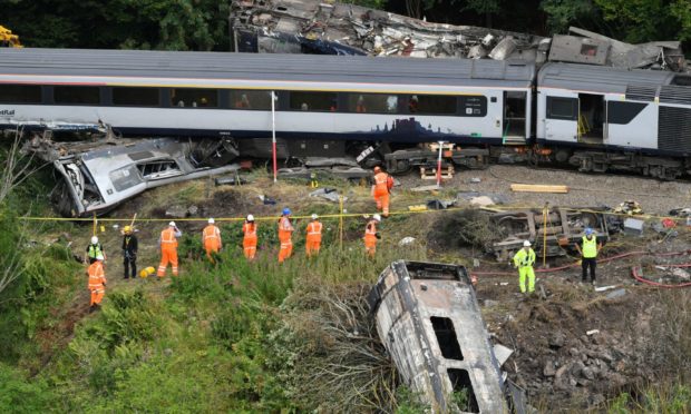 Emergency services inspect the scene of the incident near Stonehaven.