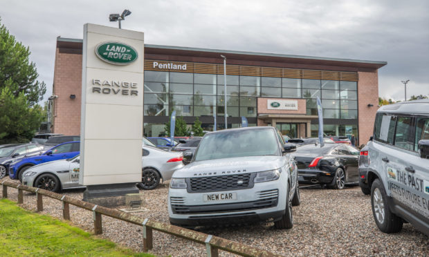 A spike of cases has been confirmed at a Land Rover dealership in Perth.