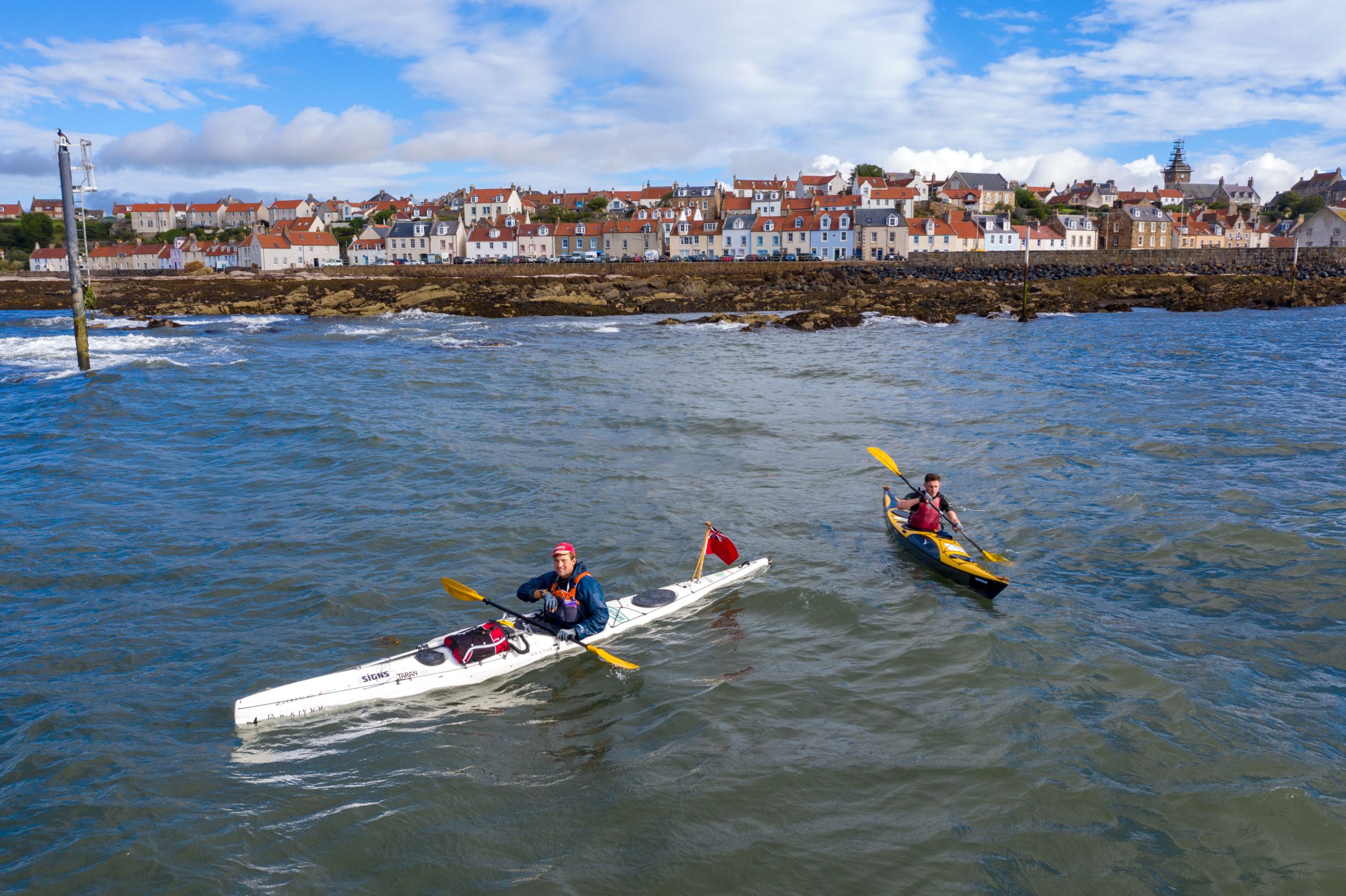 Jack Gatacre, 28, in the white kayak, and Antonio Vastano, 25, in the yellow kayak, set off from Pittenweem as part of their mammoth journey by kayak in aid of The Fishermen's Mission.