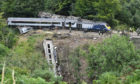 The scene near Stonehaven, Aberdeenshire, following the derailment of the ScotRail train which cost the lives of three people.
