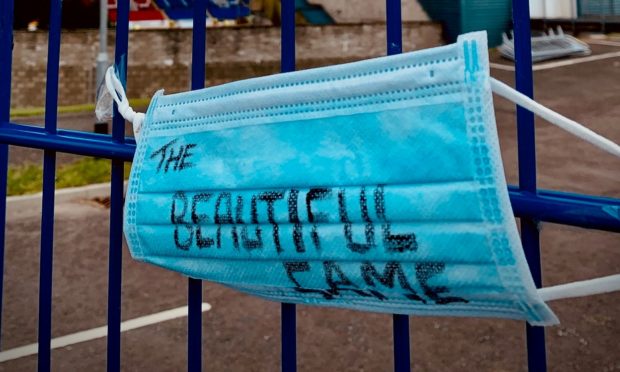 A mask tied to the railings at the home of St Johnstone