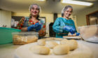 Centre chefs Munira Akter and Shweta Jariwala prepare puris