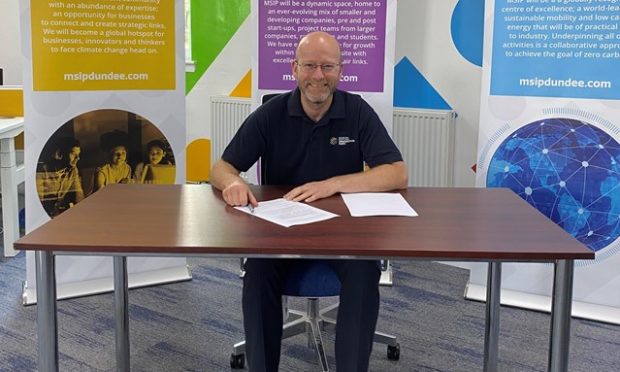 MSIP chief operating officer Colin Mcilraith. signing the agreement