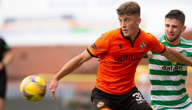 Dundee United rising star Lewis Neilson holds off Celtic's Greg Taylor.
