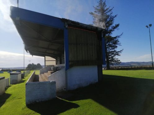 Fire creeping up the side of the Westview Park stand.