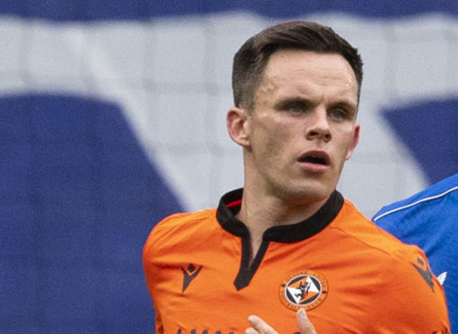 Lawrence Shankland is marked closely by Connor Goldson at Ibrox.