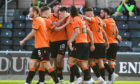United's players celebrate Lawrence Shankland's goal.
