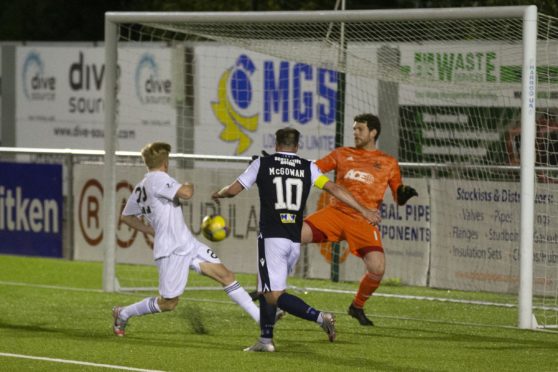 Dundee's Paul McGowan heads the winner against Cove Rangers.