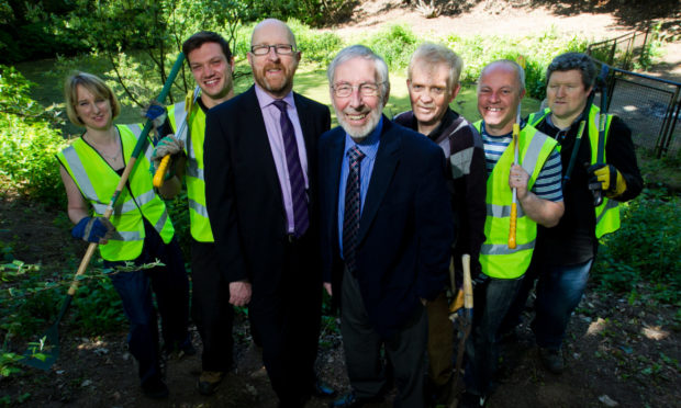 Silverburn volunteers Kate Appleyard, Jordan Ford, Ron Daniel, Jack Robertson, Duncan Mitchell and David Williams with Keith Wimbles of Voluntary Action Fund (third left).
