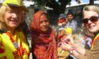Sylvia Donaldson (left), past president of the Rotary Club of St Andrews, with Irene Constable administering anti-polio vaccine to a child in rural India during a visit to support Rotary's End Polio Now campaign.