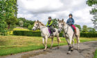 Instructor Kirstin McGregor and Gayle Ritchie pass through the grounds of Hill of Tarvit during their hack around north-east Fife.