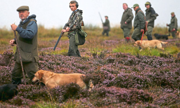 Members of a shooting party on Forneth moor near Dunkeld, Perthshire, as the grouse shooting season gets underway.