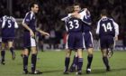 Dundee goalscorers Georgi Nemsadze and Claudio Caniggia embrace after a crucial second goal killed off their neighbours.