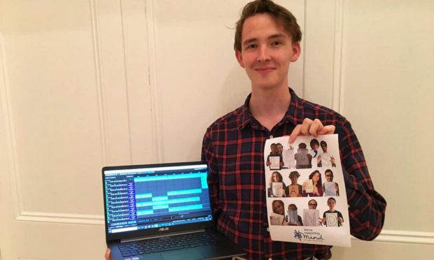 John with a copy of the album cover.