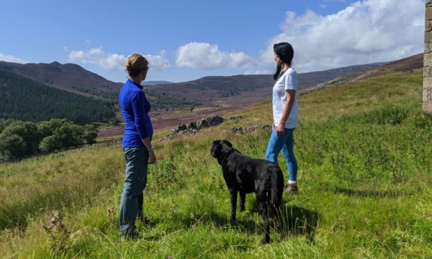 Katy Fennema of Braemar Highland Experience with Gayle Ritchie and her dog Toby in Glen Fearder.