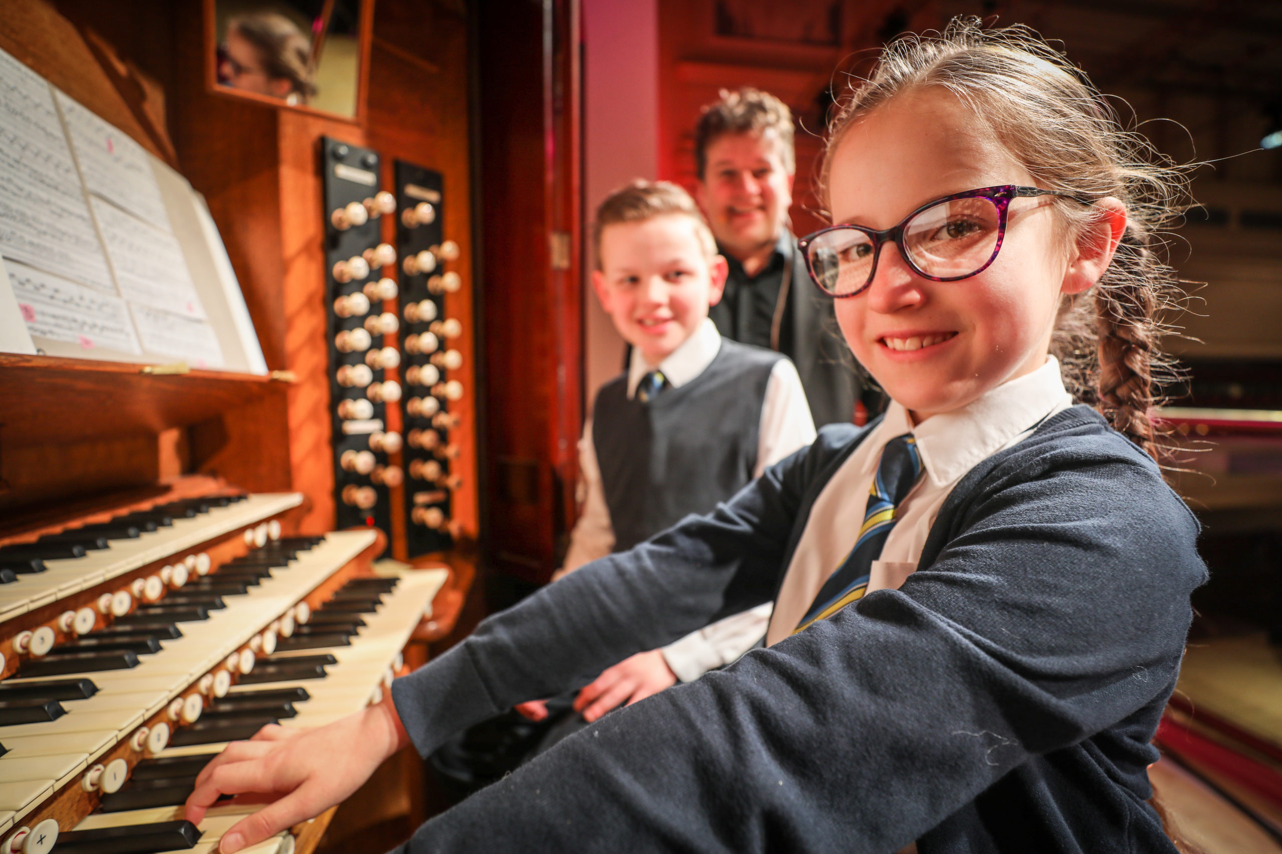 Concert organist Dan Moult in February with gifted young pianist Elizabeth Levins (9) and Euan Thomson (10) both from St Joseph's at the Caird Hall organ in early 2020.