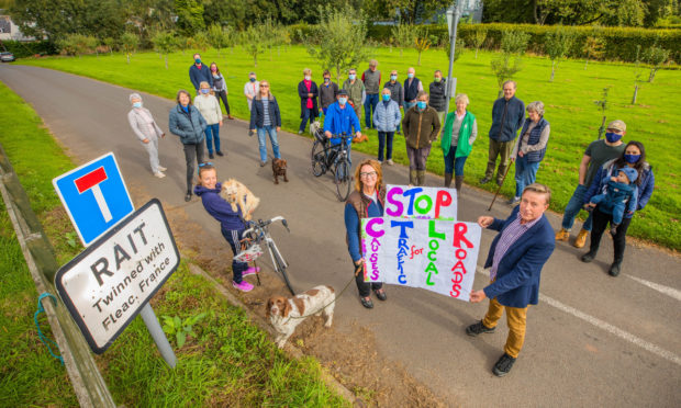 Rait residents step out in protest of the CTLR, which they say stands for Causes Traffic for Local Roads.