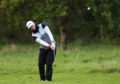 Scotland's Ewen Ferguson ground away under his snood in the cold at the Irish Open.