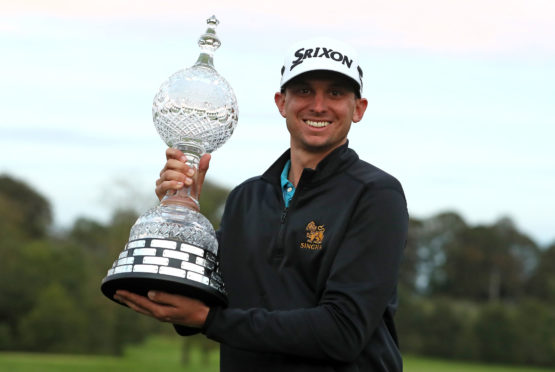 USA's John Catlin celebrates with the trophy after winning The Irish Open.