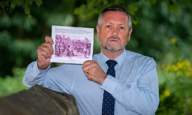 Mr Haldane with a copy of the Abolition of Slavery Act.