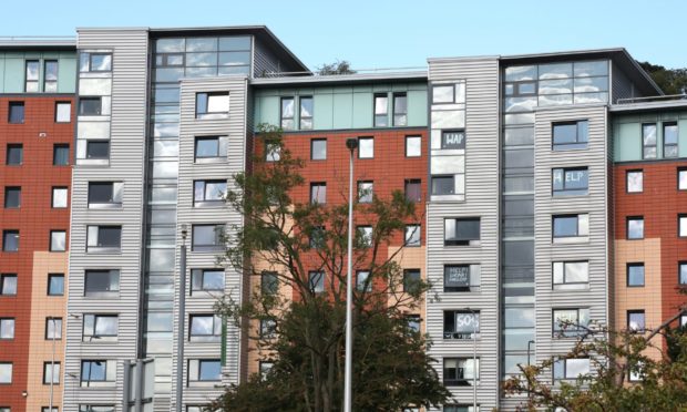 Abertay students have put  lockdown signs in their windows at Parker House.