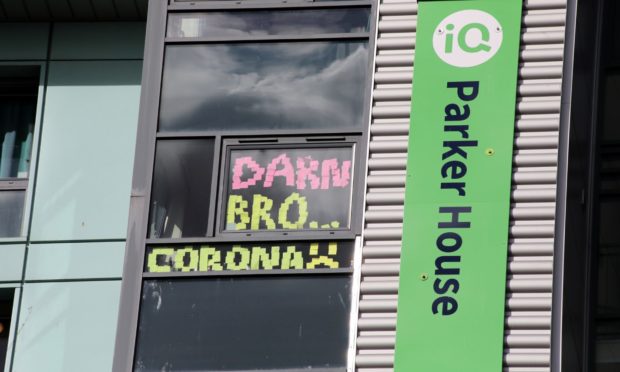 Locked-down students wrote messages on the windows of Parker House during the coronavirus outbreak.