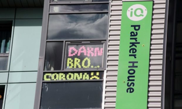 Abertay students have put lockdown signs in their windows at Parker House.