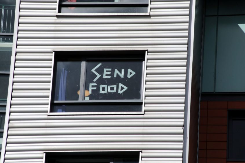 Messages on the windows of Parker House during the coronavirus outbreak.
