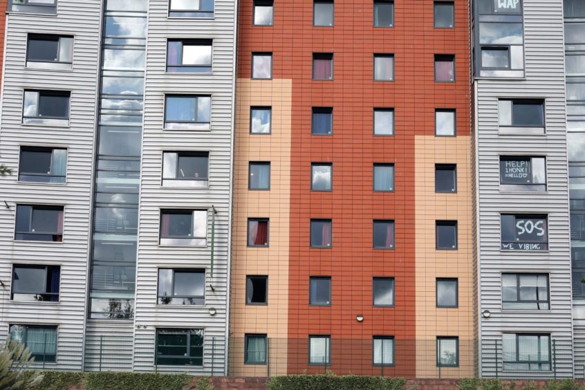 Students have put  lockdown signs in their windows at Parker House, Dundee.