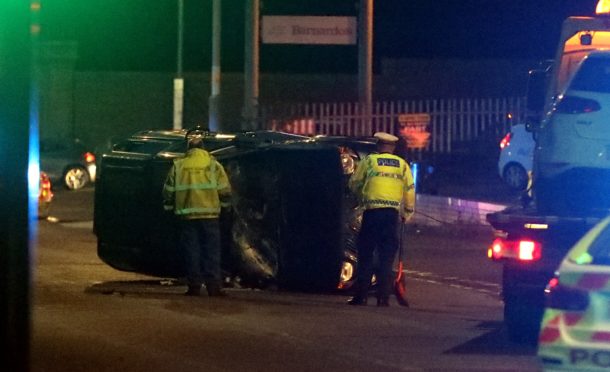 One of the cars being removed from the crash on Abroath Road.