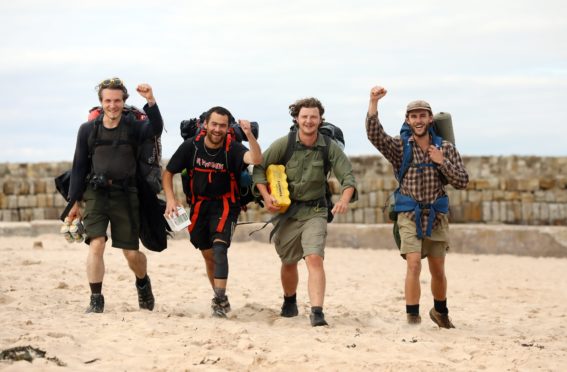 Calum Frood, Shaw Palmer, Otto Cox and Matt McDevitt arrive at the East Sands after their marathon charity effort.