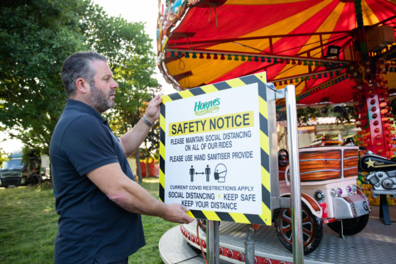 Christian Horne checks the new safety advice notices