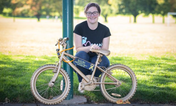 Kelly Clarkson with one of the bikes used to highlight her campaign, Megan's Journey.