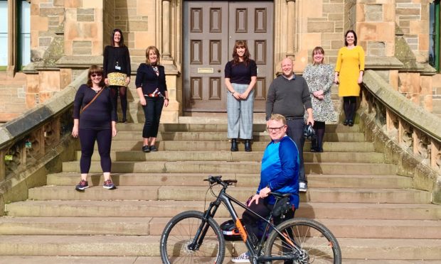 The Morgan Academy fundraisers (left to right): Diane Anderson, Vikki Black, Gloria Murray, Claire Farningham, Mike Davie, Niall McKay, Tracy Walker and Claire Lang.