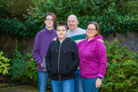 Benny, centre, with his family (left to right) brother Jack, Dad Ally and mum Clare