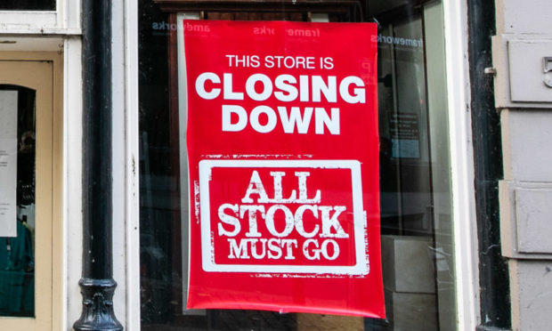 A closing down sign at Dundee's Edinburgh Woollen Mill shop