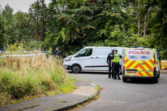 Police investigators and forensics experts spen over a week at Whitehill Road in Glenrothes where the human remains were found.