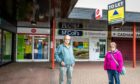 North Glenrothes Community Council chairman Ron Page with vice-chairwoman Denise Wallace outside the McColl's Store in Cadham.