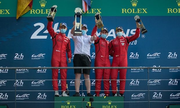 Jonny Adam (left) and the victorious TF sport team on the Le Mans 24 Hours podium