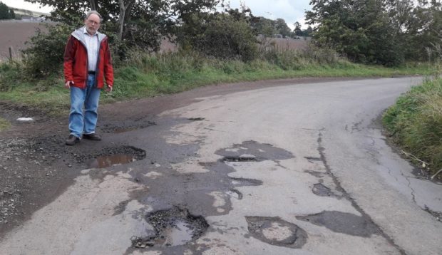 Councillor Tim Brett on the minor road leading from the A92 near Rathillet to Cupar.