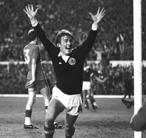 Kenny Dalglish celebrates Scotland's second goal, beating Wales in 1977 to qualify for the World Cup finals in Argentina.