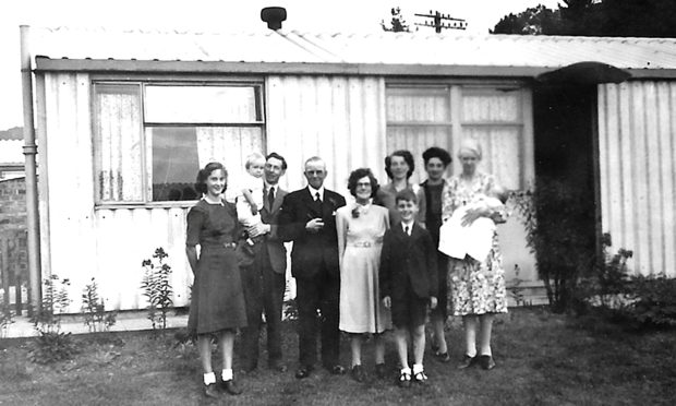 Jim Crumley's family in the front garden at 97 Glamis Road following his christening.