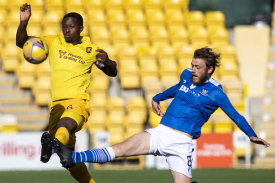 Murray Davidson makes a tackle.