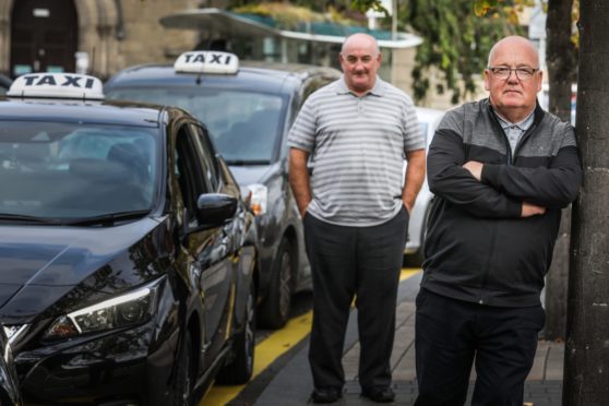 Taxi drivers Ronnie Cargill and Chris Elder at the Meadowside taxi rank.