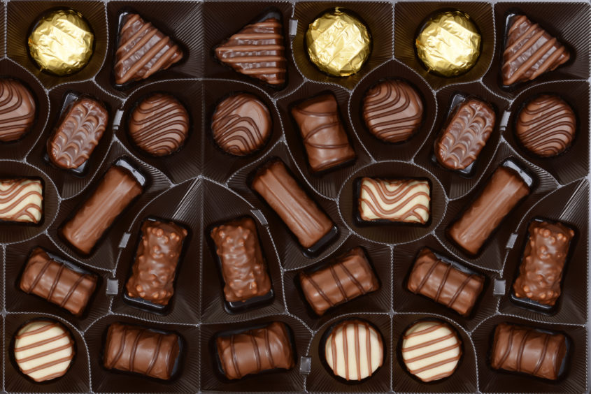 Individual chocolates within a box of Milk Tray