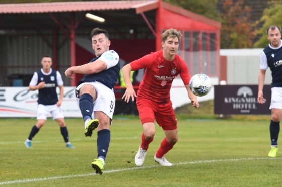 Danny Mullen scores to make it 2-0 for Dundee on his debut at Brora Rangers.